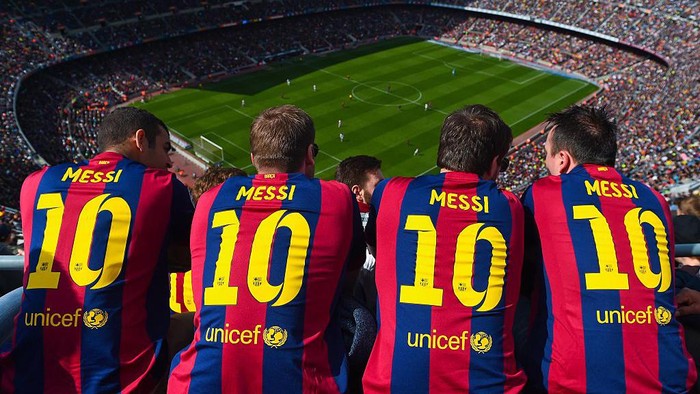 BARCELONA, SPAIN - MARCH 08: FC Barcelona supporters wearing Lionel Messi shirts watch the game from the stands during the La Liga match between FC Barcelona and Rayo Vallecano de Madrid at Camp Nou on March 8, 2015 in Barcelona, Spain.  (Photo by David Ramos/Getty Images)