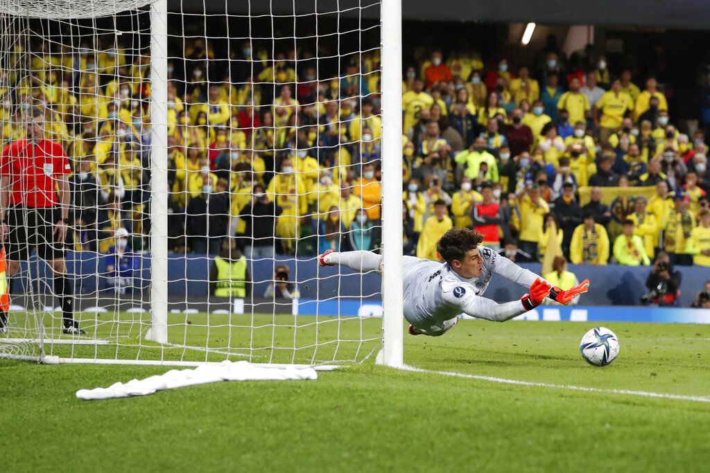 Chelsea's goalkeeper Kepa Arrizabalaga saves the final shot during the penalty shootout of the UEFA Super Cup soccer match between Chelsea and Villarreal at Windsor Park in Belfast, Northern Ireland, Wednesday, Aug. 11, 2021. (AP Photo/Peter Morrison)