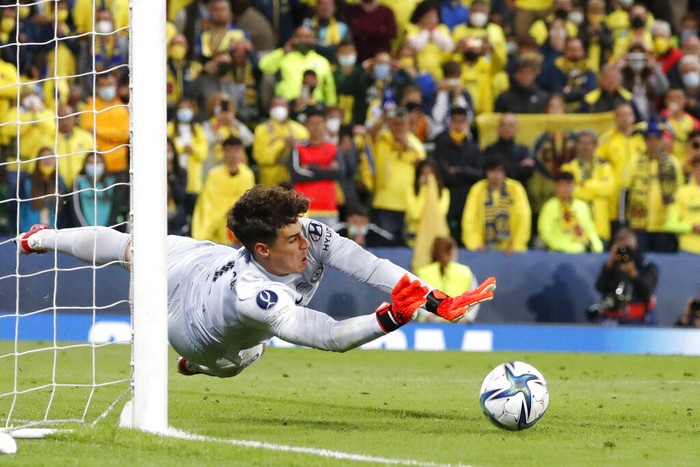 Chelseas goalkeeper Kepa Arrizabalaga saves the final shot during the penalty shootout of the UEFA Super Cup soccer match between Chelsea and Villarreal at Windsor Park in Belfast, Northern Ireland, Wednesday, Aug. 11, 2021. (AP Photo/Peter Morrison)