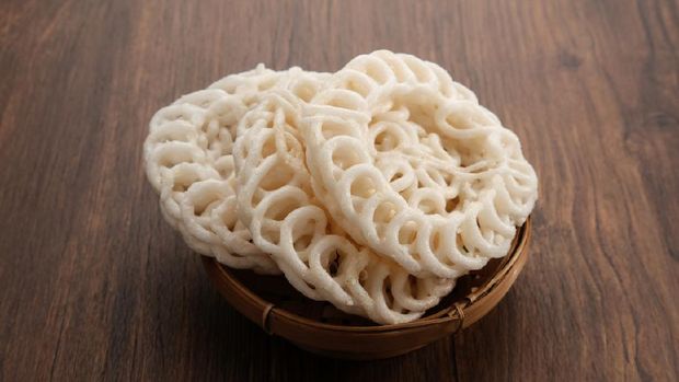 Krupuk or Kerupuk, Indonesia traditional crackers, served on bamboo plate. Close up view on kerupuk.