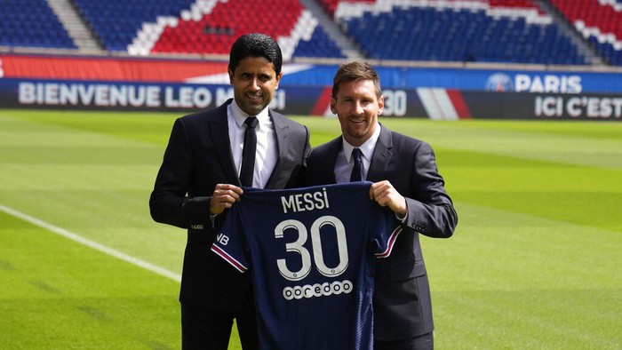 Lionel Messi, right, and PSG president Nasser Al-Al-Khelaifi hold Messis jersey Wednesday, Aug. 11, 2021 at the Parc des Princes stadium in Paris. Lionel Messi said hes been enjoying his time in Paris 