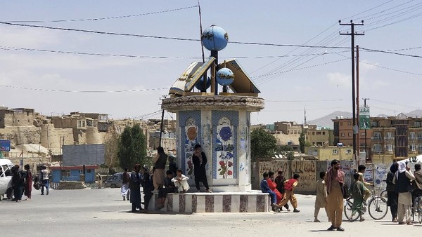 A Taliban flag flies in the main square of Kunduz city after fighting between Taliban and Afghan security forces, in Kunduz, Afghanistan, Sunday, Aug. 8, 2021. Taliban fighters Sunday took control of much of the capital of northern Afghanistans Kunduz province, including the governors office and police headquarters, a provincial council member said. (AP Photo/Abdullah Sahil)