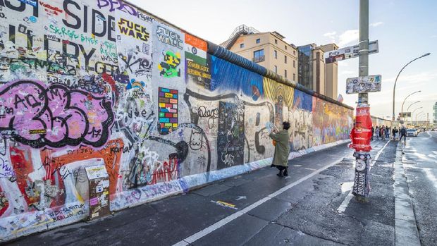 Berlin, Germany: October 10, 2017: Paintings on East Side Gallery, international memorial for freedom.