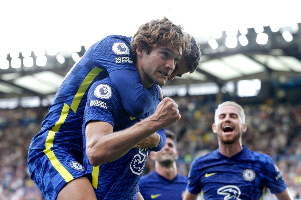 LONDON, ENGLAND - AUGUST 14: Marcos Alonso of Chelsea celebrates with teammate Mason Mount after scoring their side's first goal during the Premier League match between Chelsea and Crystal Palace at Stamford Bridge on August 14, 2021 in London, England. (Photo by Henry Browne/Getty Images)