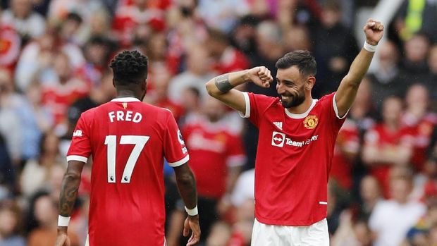 Soccer Football - Premier League - Manchester United v Leeds United - Old Trafford, Manchester, Britain - August 14, 2021 Manchester United's Bruno Fernandes celebrates scoring their fourth goal to complete his hat-trick REUTERS/Phil Noble EDITORIAL USE ONLY. No use with unauthorized audio, video, data, fixture lists, club/league logos or 'live' services. Online in-match use limited to 75 images, no video emulation. No use in betting, games or single club /league/player publications.  Please contact your account representative for further details.