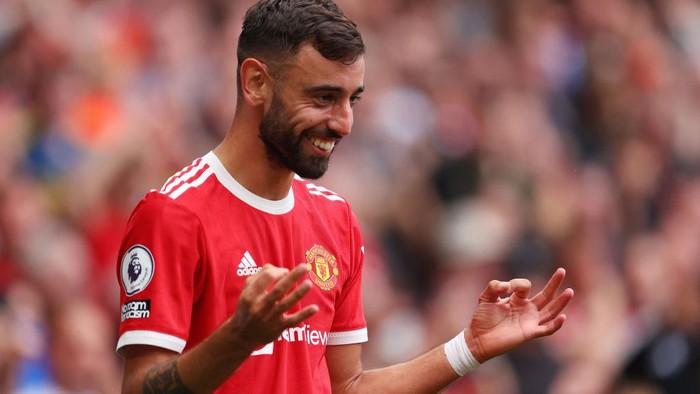 MANCHESTER, ENGLAND - AUGUST 14: Bruno Fernandes of Manchester United celebrates after scoring a goal during the Premier League match between Manchester United  and  Leeds United at Old Trafford on August 14, 2021 in Manchester, England. (Photo by Catherine Ivill/Getty Images,)