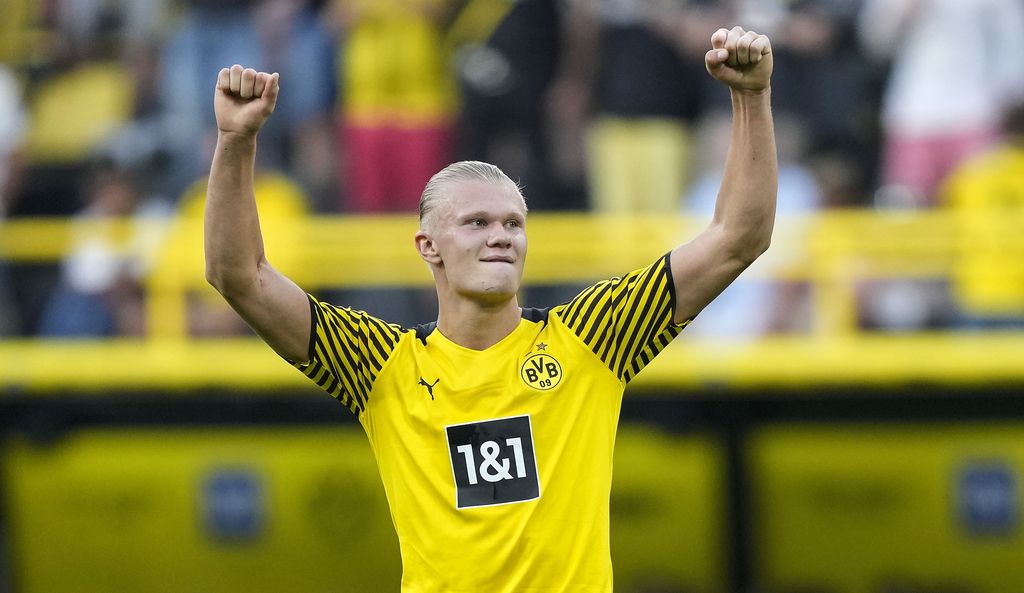 Dortmund's Erling Haaland celebrates after he scored his side's 5th goal during the German Bundesliga soccer match between Borussia Dortmund and Eintracht Frankfurt in Dortmund, Germany, Saturday, Aug. 14, 2021. (AP Photo/Martin Meissner)