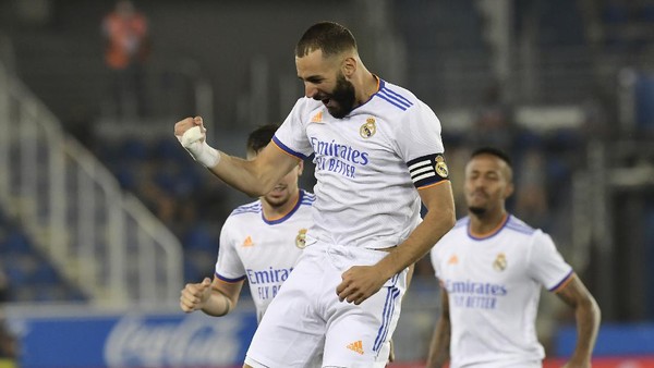 Karim Benzema Real Madrids Karim Benzema celebrates after scoring his sides opening goal during a Spanish La Liga soccer match between Alaves and Real Madrid at the Mendizorroza stadium in Vitoria, Spain, Saturday, Aug. 14, 2021. (AP Photo/Alvaro Barrientos)