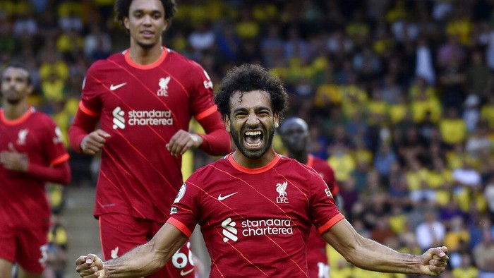 Liverpools Mohamed Salah celebrates after scoring his sides third goal during the English Premier League soccer match between Norwich City and Liverpool at Carrow Road Stadium in Norwich, England, Saturday, Aug. 14, 2021. (AP photo/Rui Vieira)