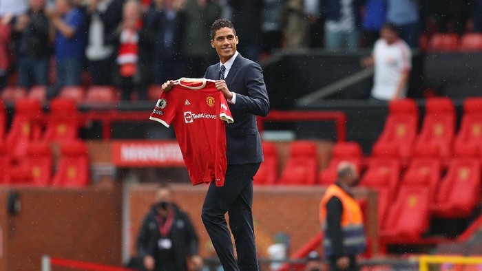 MANCHESTER, ENGLAND - AUGUST 14: New signing, Raphael Varane of Manchester United is introduced to fans on the pitch prior to the Premier League match between Manchester United  and  Leeds United at Old Trafford on August 14, 2021 in Manchester, England. (Photo by Catherine Ivill/Getty Images,)