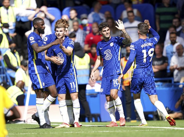 Chelseas Christian Pulisic, second right, celebrates scoring their sides second goal of the game during the English Premier League soccer match between Chelsea and Crystal Palace at Stamford Bridge, London, Saturday, Aug. 14, 2021. (Tess Derry/PA via AP)