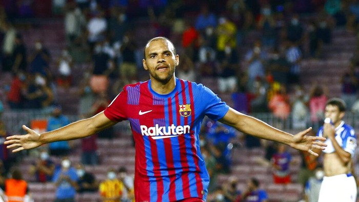 Barcelona's Martin Braithwaite celebrates after scoring his side's third goal during a Spanish La Liga soccer match between Barcelona and Real Sociedad at Camp Nou stadium in Barcelona, Spain, Sunday, Aug. 15, 2021. (AP Photo/Joan Monfort)