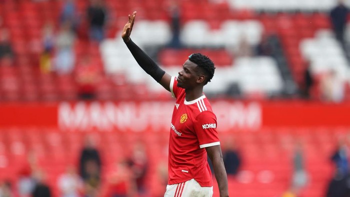 MANCHESTER, ENGLAND - AUGUST 14: Paul Pogba of Manchester United acknowledges the fans following victory in the Premier League match between Manchester United  and  Leeds United at Old Trafford on August 14, 2021 in Manchester, England. (Photo by Catherine Ivill/Getty Images,)