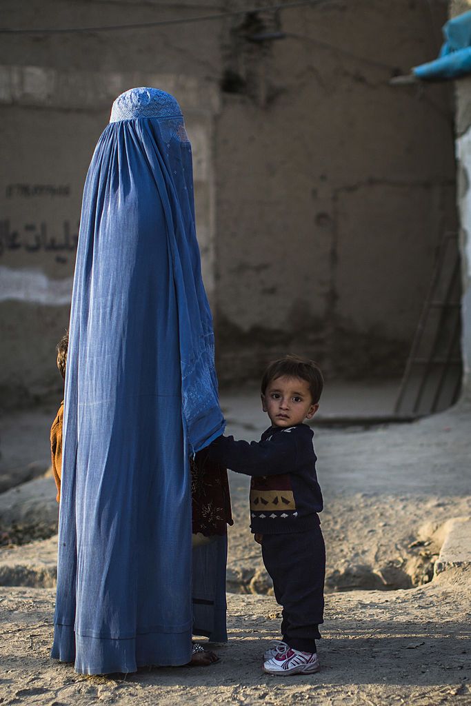 KABUL, AFGANISTAN - AUGUST 13 : Displaced Afghan women and children from Kunduz are seen at a mosque that is sheltering them on August 13, 2021 in Kabul, Afghanistan.  Tensions are high as the Taliban advance on the capital city after taking Herat and the country's second-largest city Kandahar. (Photo by Paula Bronstein /Getty Images)