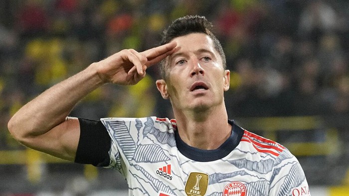 Bayerns Robert Lewandowski celebrates after scoring his sides third goal during the German Supercup soccer match between Borussia Dortmund and Bayern Munich in Dortmund, Germany, Tuesday, Aug. 17, 2021. (AP Photo/Martin Meissner)