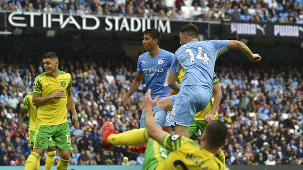 Manchester City's Aymeric Laporte scores his side's third goal during the English Premier League soccer match between Manchester City and Norwich City at Etihad stadium in Manchester, England, Saturday, Aug. 21, 2021. (AP Photo/Rui Vieira)