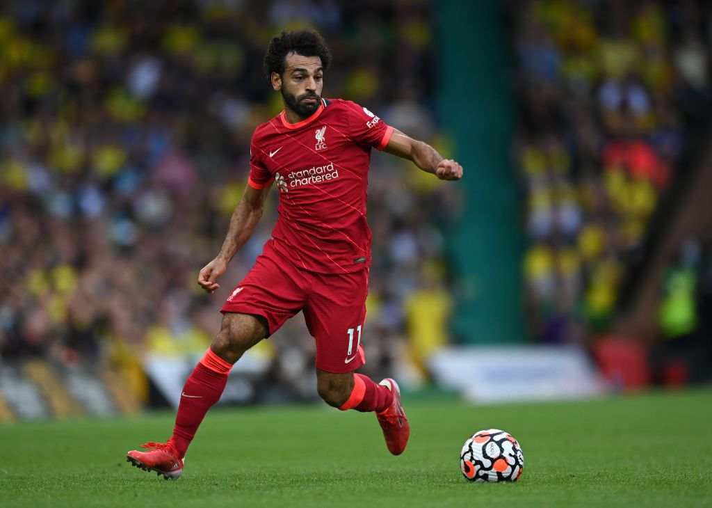 NORWICH, ENGLAND - AUGUST 14:  Mohamed Salah of Liverpool runs with the ball during the Premier League match between Norwich City  and  Liverpool at Carrow Road on August 14, 2021 in Norwich, England. (Photo by Shaun Botterill/Getty Images)