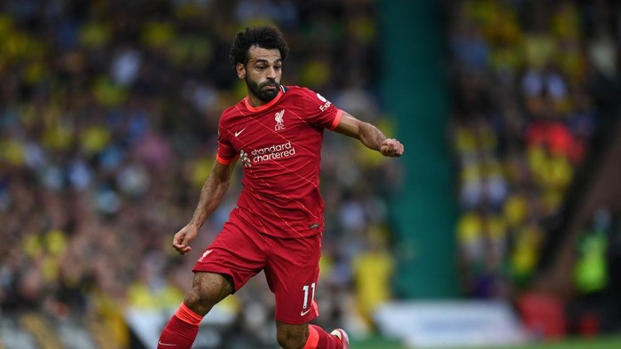 NORWICH, ENGLAND - AUGUST 14:  Mohamed Salah of Liverpool runs with the ball during the Premier League match between Norwich City  and  Liverpool at Carrow Road on August 14, 2021 in Norwich, England. (Photo by Shaun Botterill/Getty Images)