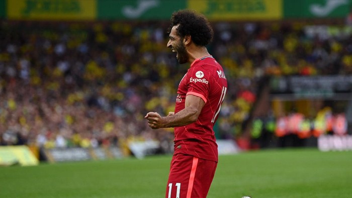 NORWICH, ENGLAND - AUGUST 14: Mohamed Salah of Liverpool celebrates after scoring their sides third goal during the Premier League match between Norwich City and Liverpool at Carrow Road on August 14, 2021 in Norwich, England. (Photo by Shaun Botterill/Getty Images)