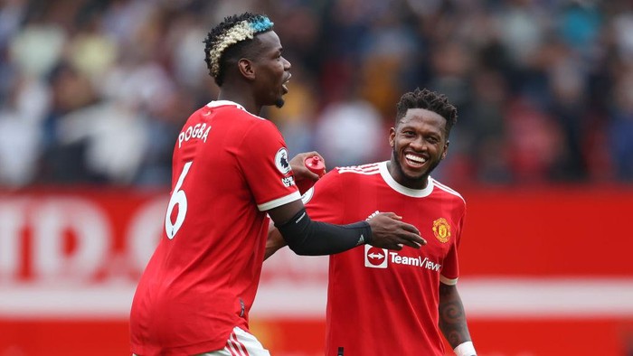 MANCHESTER, ENGLAND - AUGUST 14: Fred and Paul Pogba of Manchester United interact during the Premier League match between Manchester United  and  Leeds United at Old Trafford on August 14, 2021 in Manchester, England. (Photo by Catherine Ivill/Getty Images,)