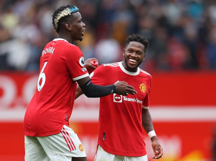 MANCHESTER, ENGLAND - AUGUST 14: Fred and Paul Pogba of Manchester United interact during the Premier League match between Manchester United  and  Leeds United at Old Trafford on August 14, 2021 in Manchester, England. (Photo by Catherine Ivill/Getty Images,)