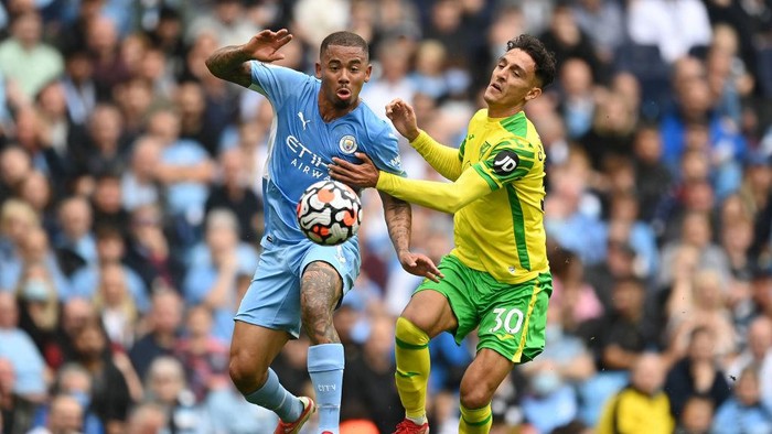 MANCHESTER, ENGLAND - AUGUST 21: Gabriel Jesus of Manchester City battles for possession with Dimitris Giannoulis of Norwich City during the Premier League match between Manchester City and Norwich City at Etihad Stadium on August 21, 2021 in Manchester, England. (Photo by Shaun Botterill/Getty Images )