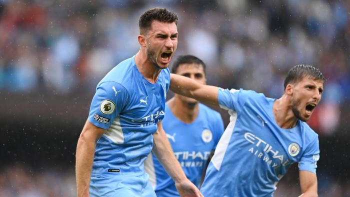MANCHESTER, ENGLAND - AUGUST 21: Aymeric Laporte of Manchester City celebrates after scoring their sides third goal with team mate Ruben Dias during the Premier League match between Manchester City and Norwich City at Etihad Stadium on August 21, 2021 in Manchester, England. (Photo by Michael Regan/Getty Images)