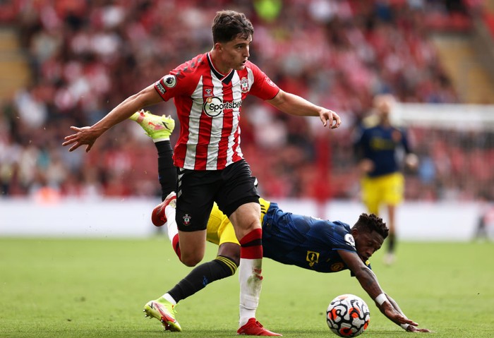 SOUTHAMPTON, ENGLAND - AUGUST 22: Valentino Livramento of Southampton looks to break away from Fred of Manchester United during the Premier League match between Southampton and Manchester United at St Marys Stadium on August 22, 2021 in Southampton, England. (Photo by Ryan Pierse/Getty Images)
