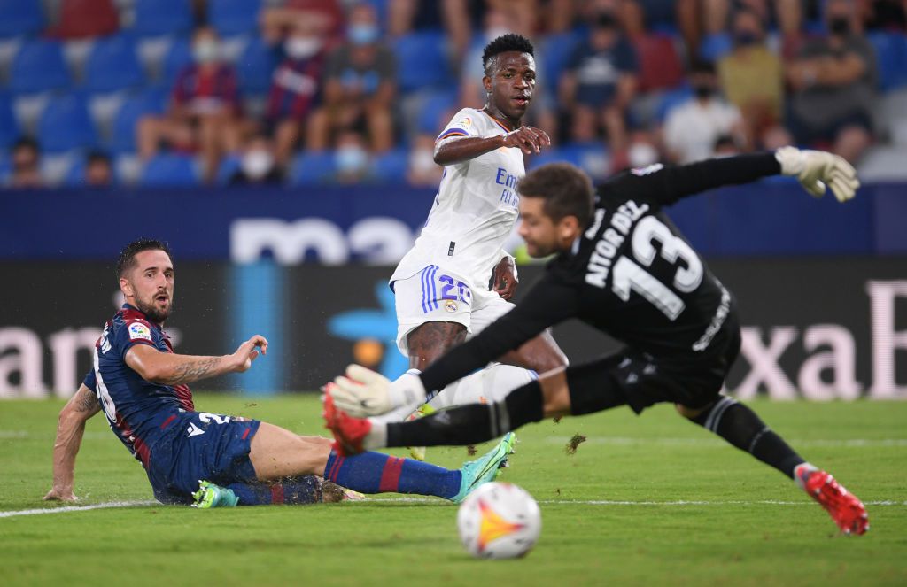 VALENCIA, SPAIN - AUGUST 22: Vinicius Junior of Real Madrid scores their team's second goal during the LaLiga Santander match between Levante UD and Real Madrid CF at Ciutat de Valencia Stadium on August 22, 2021 in Valencia, Spain . (Photo by Aitor Alcalde/Getty Images)