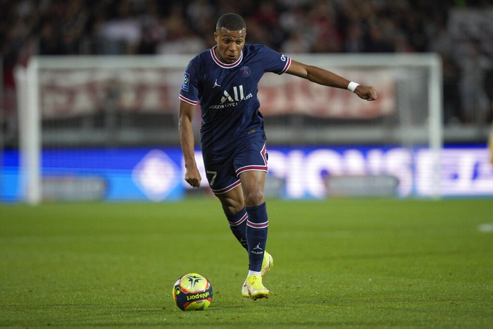 Kylian Mbappe PSG's Kylian Mbappe runs with the ball during a French League One soccer match between Brest and PSG at the Francis-Le Ble stadium in Brest, France, Friday, Aug. 20, 2021. (AP Photo/Daniel Cole)