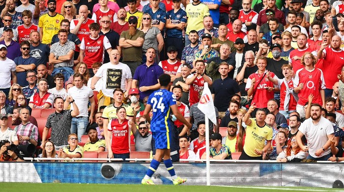 LONDON, ENGLAND - AUGUST 22: (EDITORS NOTE: Image contains profanity) Fans of Arsenal react as Reece James of Chelsea celebrates after scoring their sides second goal during the Premier League match between Arsenal and Chelsea at Emirates Stadium on August 22, 2021 in London, England. (Photo by Michael Regan/Getty Images)