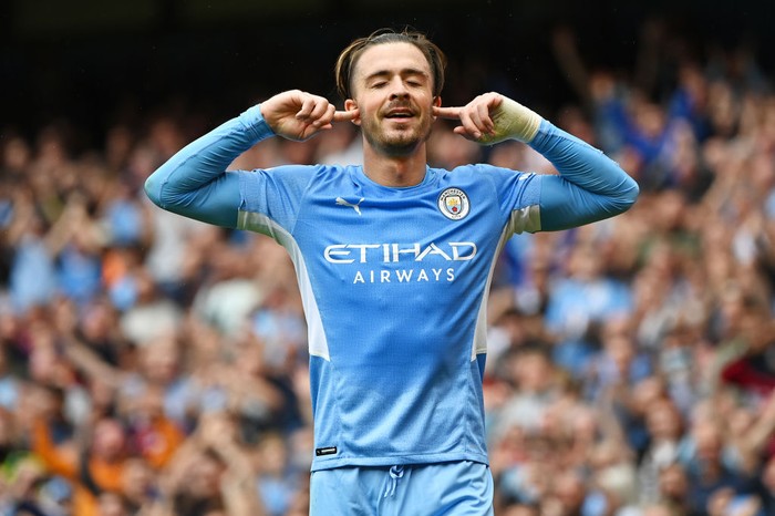 MANCHESTER, ENGLAND - AUGUST 21: Jack Grealish of Manchester City celebrates after scoring their sides second goal during the Premier League match between Manchester City and Norwich City at Etihad Stadium on August 21, 2021 in Manchester, England. (Photo by Shaun Botterill/Getty Images )