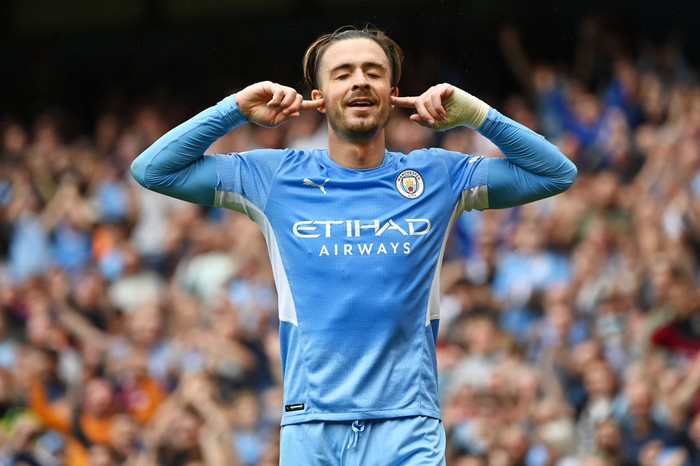 Jack Grealish MANCHESTER, ENGLAND - AUGUST 21: Jack Grealish of Manchester City celebrates after scoring their side's second goal during the Premier League match between Manchester City and Norwich City at Etihad Stadium on August 21, 2021 in Manchester, England. (Photo by Shaun Botterill/Getty Images )