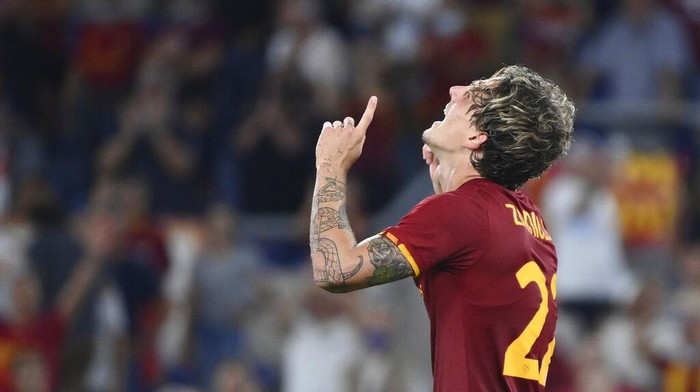 Romas Nicolo Zaniolo celebrates after scoring his sides 2nd goal, during the Europa Conference League play-offs, return-leg soccer match between Roma and Trabzonspor at the Rome Olympic stadium, Thursday, Aug. 26, 2021. (Alfredo Falcone/LaPresse via AP)