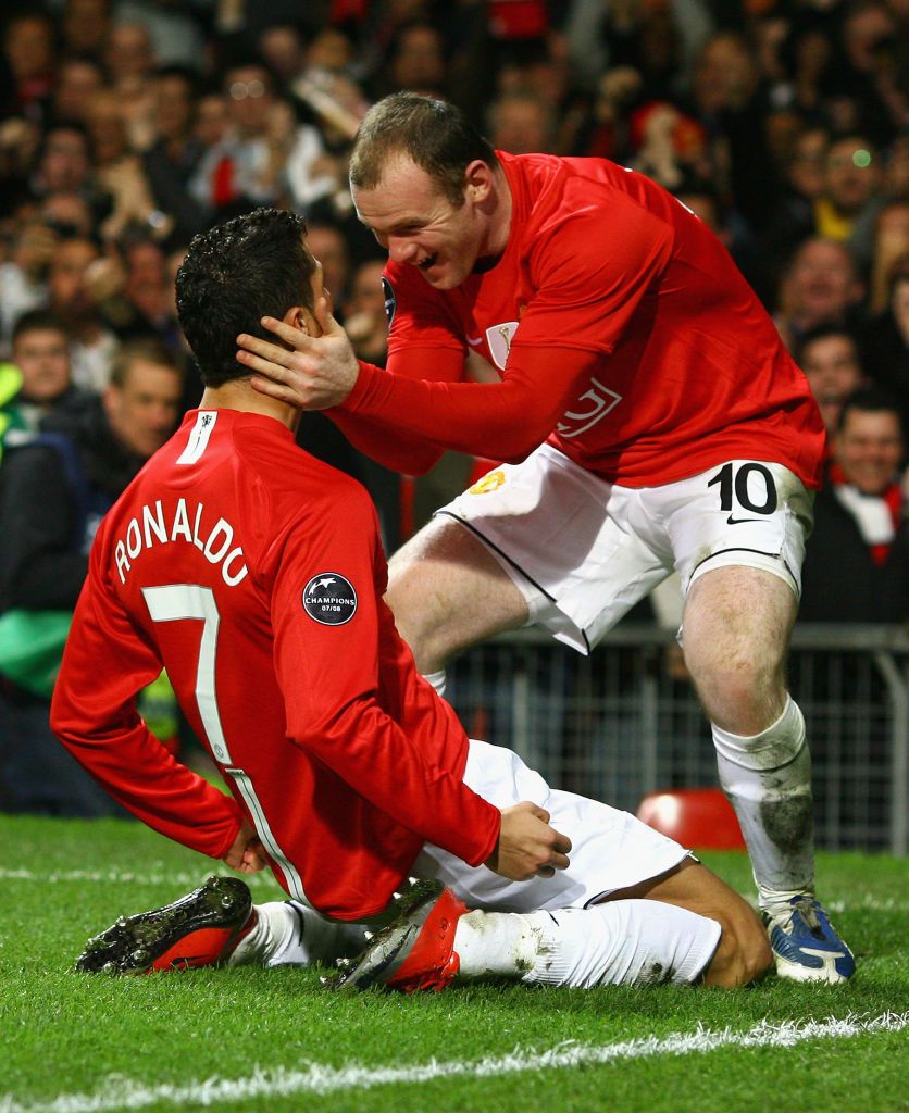 MANCHESTER, UNITED KINGDOM - MARCH 11: Cristiano Ronaldo of Manchester United is congratulated by team mate Wayne Rooney after scoring his team's second goal during the UEFA Champions League Round of Sixteen, Second Leg match between Manchester United and Inter Milan at Old Trafford on March 11, 2009 in Manchester, England. (Photo by Alex Livesey/Getty Images)