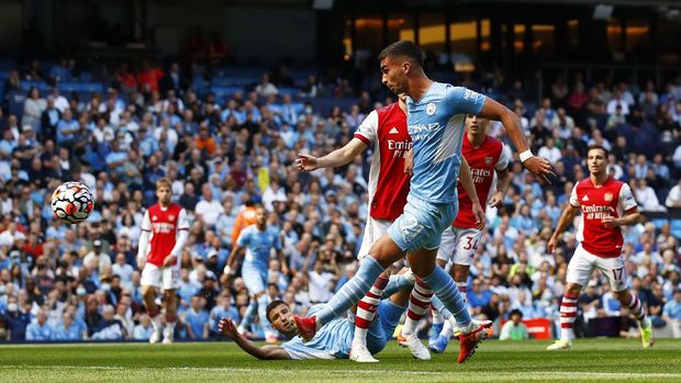 SOCCER-ENGLAND-MCI-ARS/REPORT Soccer Football - Premier League - Manchester City v Arsenal - Etihad Stadium, Manchester, Britain - August 28, 2021 Manchester City's Ferran Torres scores their second goal Action Images via Reuters/Jason Cairnduff EDITORIAL USE ONLY. No use with unauthorized audio, video, data, fixture lists, club/league logos or 'live' services. Online in-match use limited to 75 images, no video emulation. No use in betting, games or single club /league/player publications. Please contact your account representative for further details.