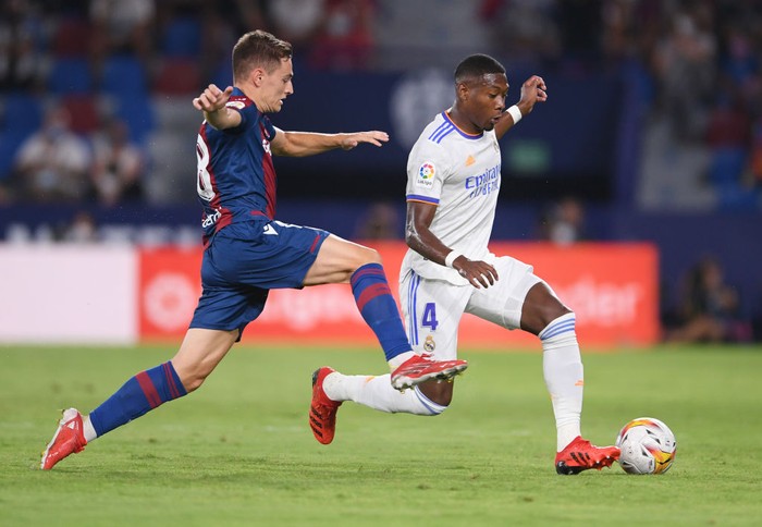VALENCIA, SPAIN - AUGUST 22: Jorge De Frutos of Levante and David Alaba of Real Madrid battle for the ball during the LaLiga Santander match between Levante UD and Real Madrid CF at Ciutat de Valencia Stadium on August 22, 2021 in Valencia, Spain . (Photo by Aitor Alcalde/Getty Images)