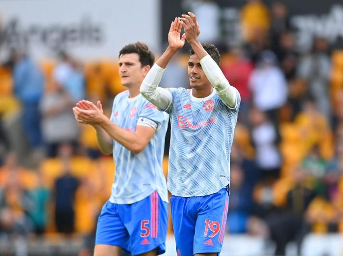 WOLVERHAMPTON, ENGLAND - AUGUST 29: Raphael Varane and Harry Maguire look on after the Premier League match between Wolverhampton Wanderers  and  Manchester United at Molineux on August 29, 2021 in Wolverhampton, England. (Photo by Michael Regan/Getty Images)