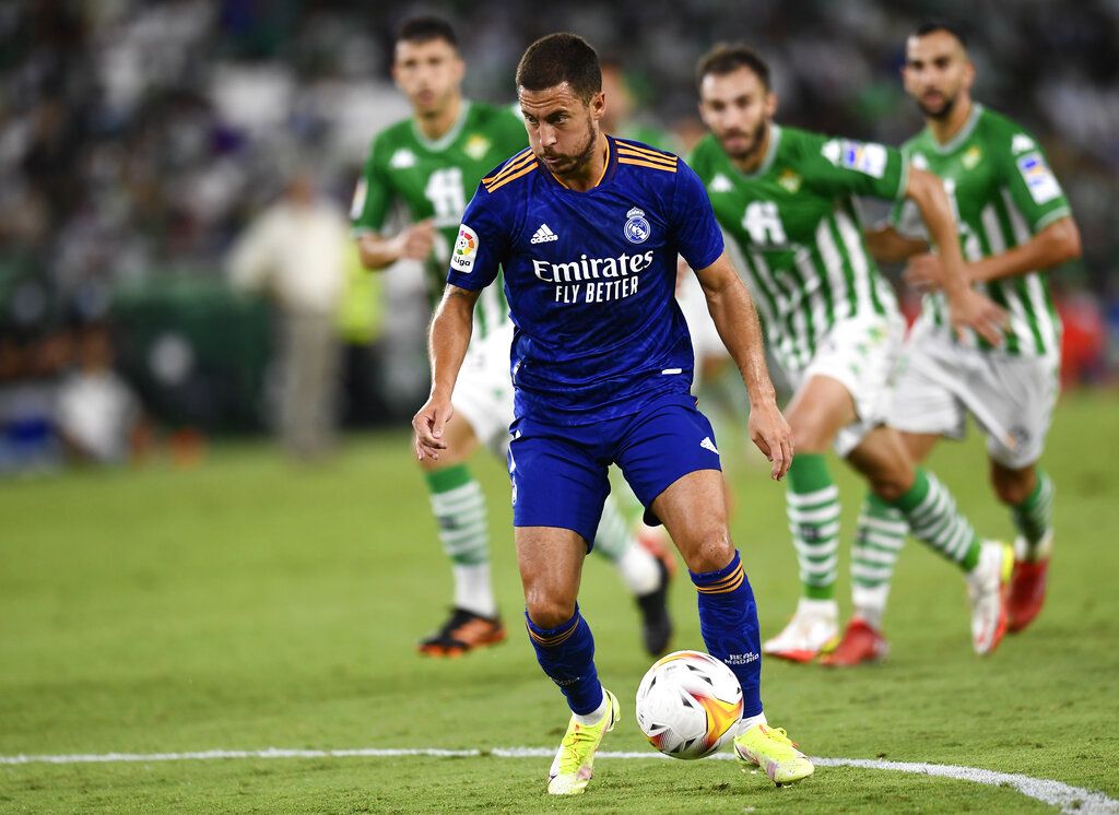 Real Madrid's Eden Hazard controls the ball during the Spanish La Liga soccer match between Real Betis and Real Madrid at Benito Villamarin stadium in Seville, Spain, Saturday, Aug. 28, 2021. (AP Photo/Jose Breton)