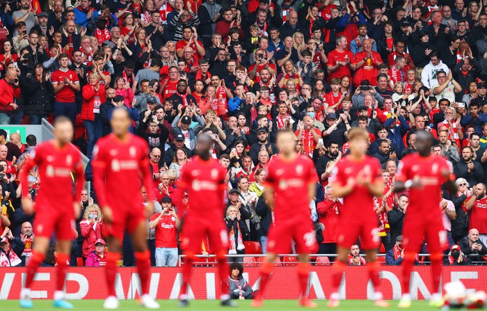 LIVERPOOL, ENGLAND - AUGUST 21: Fans of Liverpool take part in a minutes applause in remembrance of Andrew Devine, the 97th victim of the Hillsborough Stadium disaster prior to the Premier League match between Liverpool and Burnley at Anfield on August 21, 2021 in Liverpool, England. (Photo by Catherine Ivill/Getty Images)