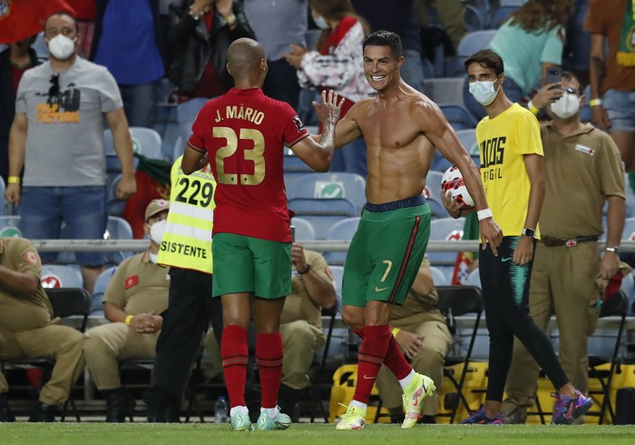 Cristiano Ronaldo Portugal's Cristiano Ronaldo, right, celebrates after scoring his side's second goal during the World Cup 2022 group A qualifying soccer match between Portugal and the Republic of Ireland at the Algarve stadium outside Faro, Portugal, Wednesday, Sept. 1, 2021. (AP Photo/Armando Franca)