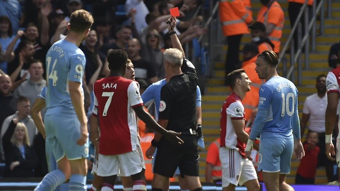 Arsenals Granit Xhaka sees the red card during the English Premier League soccer match between Manchester City and Arsenal at Etihad stadium in Manchester, England, Saturday, Aug. 28, 2021. (AP Photo/Rui Vieira)