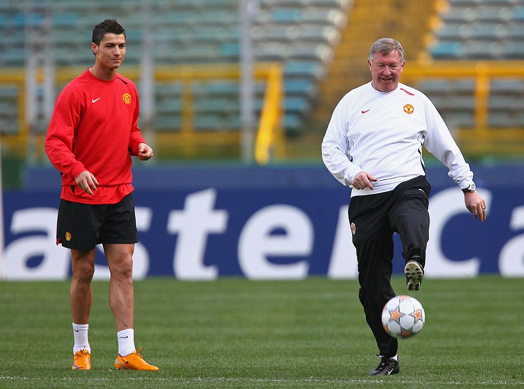 MOSCOW - MAY 21:  Manchester United manager Sir Alex Ferguson (C) smiles with Cristiano Ronaldo of Manchester United after the UEFA Champions League Final match between Manchester United and Chelsea at the Luzhniki Stadium on May 21, 2008 in Moscow, Russia.  (Photo by Alex Livesey/Getty Images)