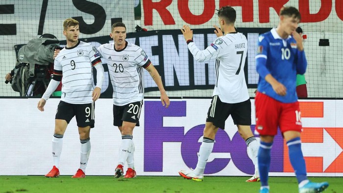 ST GALLEN, SWITZERLAND - SEPTEMBER 02: Timo Werner of Germany celebrates with Robin Gosens and Kai Havertz after scoring their teams first goal during the 2022 FIFA World Cup Qualifier match between Liechtenstein and Germany at Kybunpark on September 02, 2021 in St Gallen, Sankt Gallen. (Photo by Alexander Hassenstein/Getty Images)