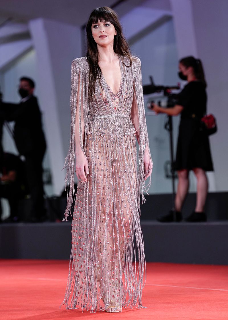 Dakota Johnson poses for photographers upon arrival at the premiere of the film 'The Lost Daughter' during the 78th edition of the Venice Film Festival in Venice, Italy, Friday, Sep, 3, 2021. (AP Photo/Domenico Stinellis)