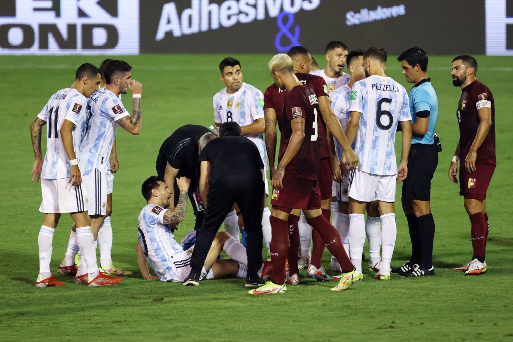 CARACAS, VENEZUELA - SEPTEMBER 02: Lionel Messi of Argentina reacts after being fouled during a match between Venezuela and Argentina as part of South American Qualifiers for Qatar 2022 at Estadio Olimpico on September 02, 2021 in Caracas, Venezuela. (Photo by Miguel Gutiérrez-Pool/Getty Images)