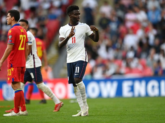 LONDON, ENGLAND - SEPTEMBER 05: Bukayo Saka of England celebrates after scoring their teams fourth goal during the 2022 FIFA World Cup Qualifier match between England and Andorra at Wembley Stadium on September 05, 2021 in London, England. (Photo by Shaun Botterill/Getty Images)