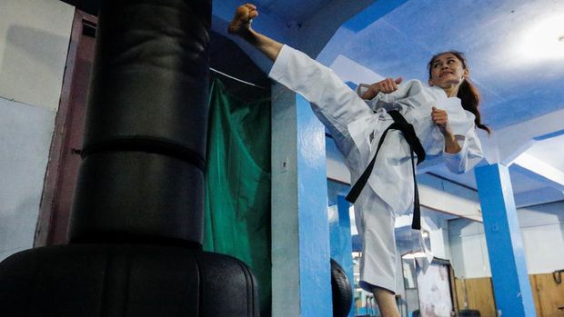 Meena Asadi, a 28 year-old former Afghan martial arts athlete, practices karate at Refugee Shotokan Karate Club dojo in Cisarua, West Java province, Indonesia, August 18, 2021. Picture taken August 18, 2021 REUTERS/Ajeng Dinar Ulfiana
