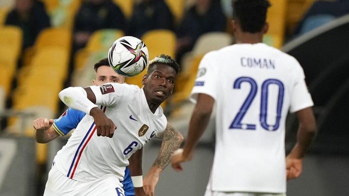 Frances Paul Pogba in action during the World Cup 2022 group D qualifying soccer match between Ukraine and France at the Olimpiyskiy Stadium in Kyiv, Ukraine, Saturday, Sept. 4, 2021. (AP Photo/Efrem Lukatsky)