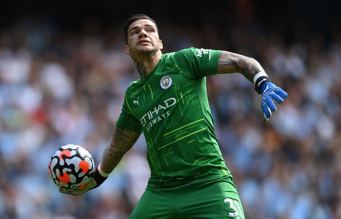 Ederson MANCHESTER, ENGLAND - JULY 26: Ederson of Manchester City holds the Golden Glove Award and Kevin De Bruyne of Manchester City holds the Playmaker Award after the Premier League match between Manchester City and Norwich City at Etihad Stadium on July 26, 2020 in Manchester, England.Football Stadiums around Europe remain empty due to the Coronavirus Pandemic as Government social distancing laws prohibit fans inside venues resulting in all fixtures being played behind closed doors. (Photo by Shaun Botterill/Getty Images)